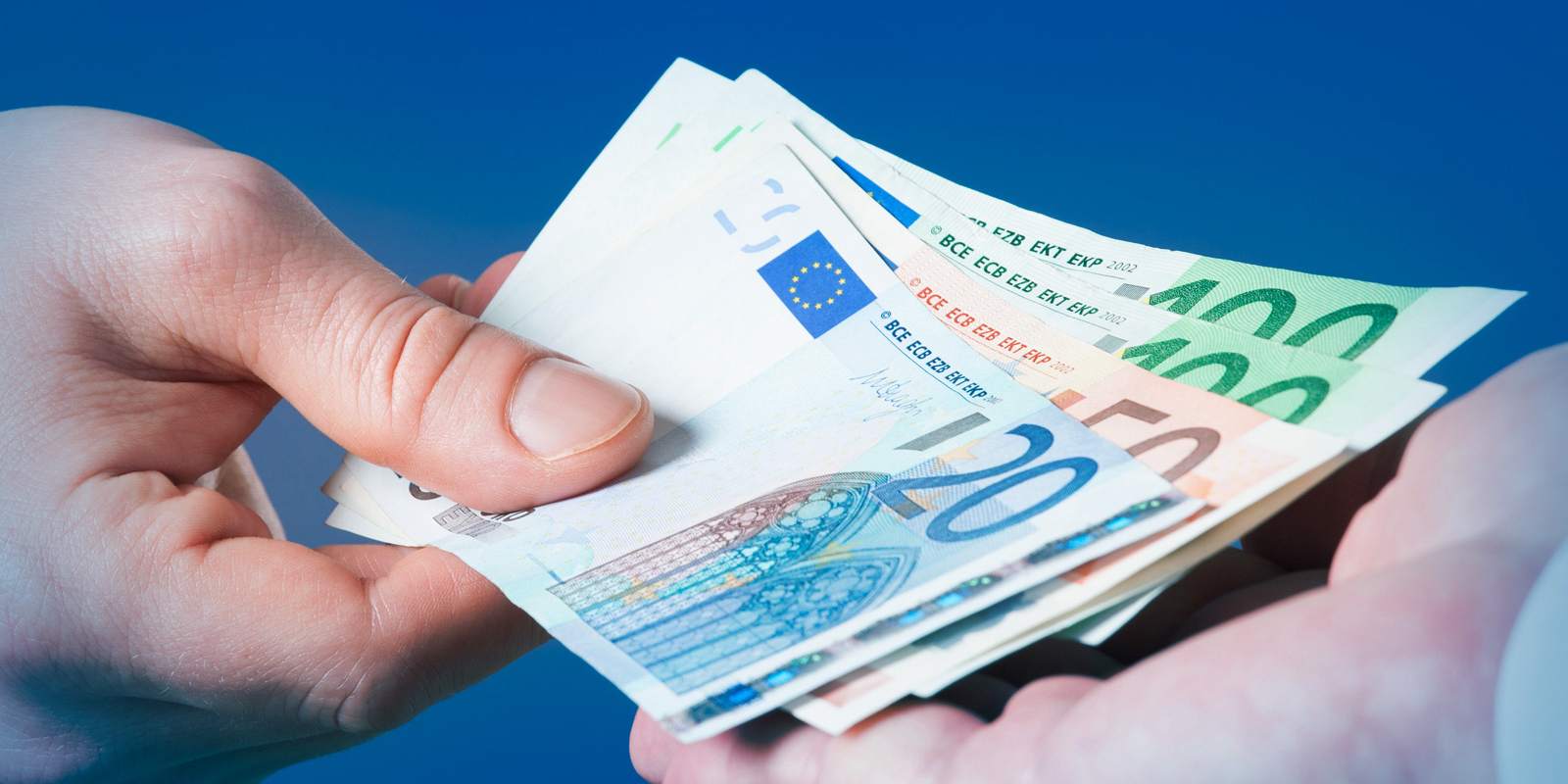 Image of hand holding euros