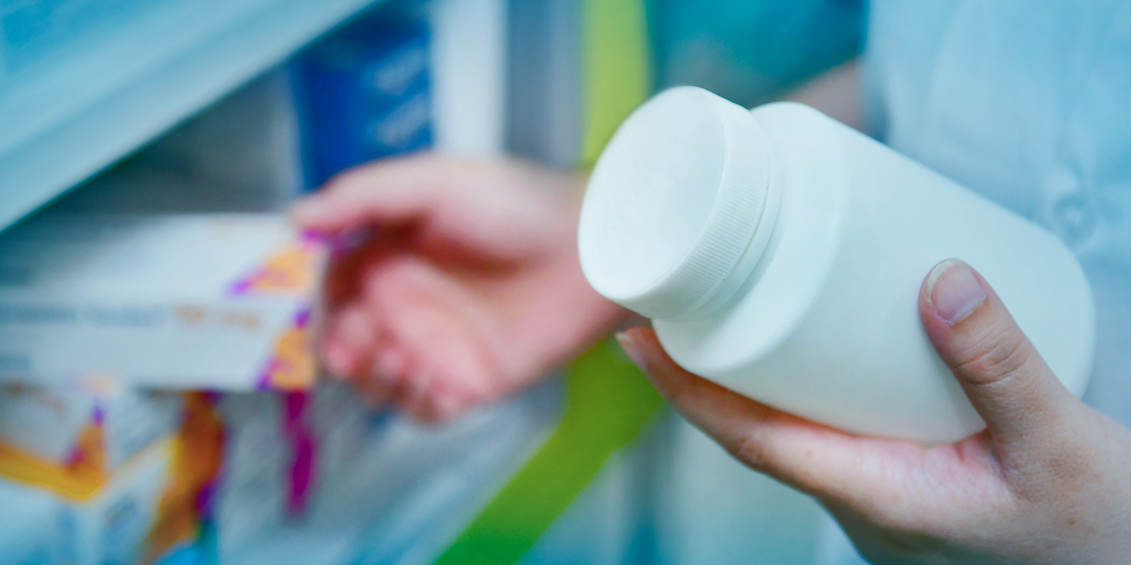 Image of pharmacist selecting drugs