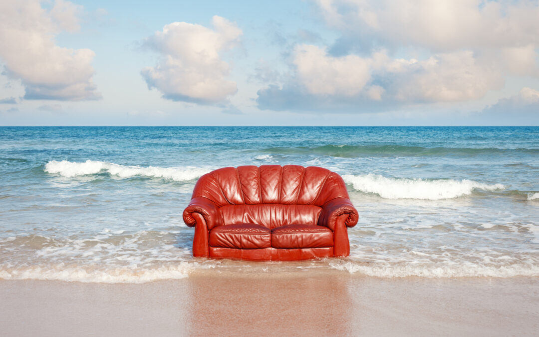 Red Leather Couch on the Beach
