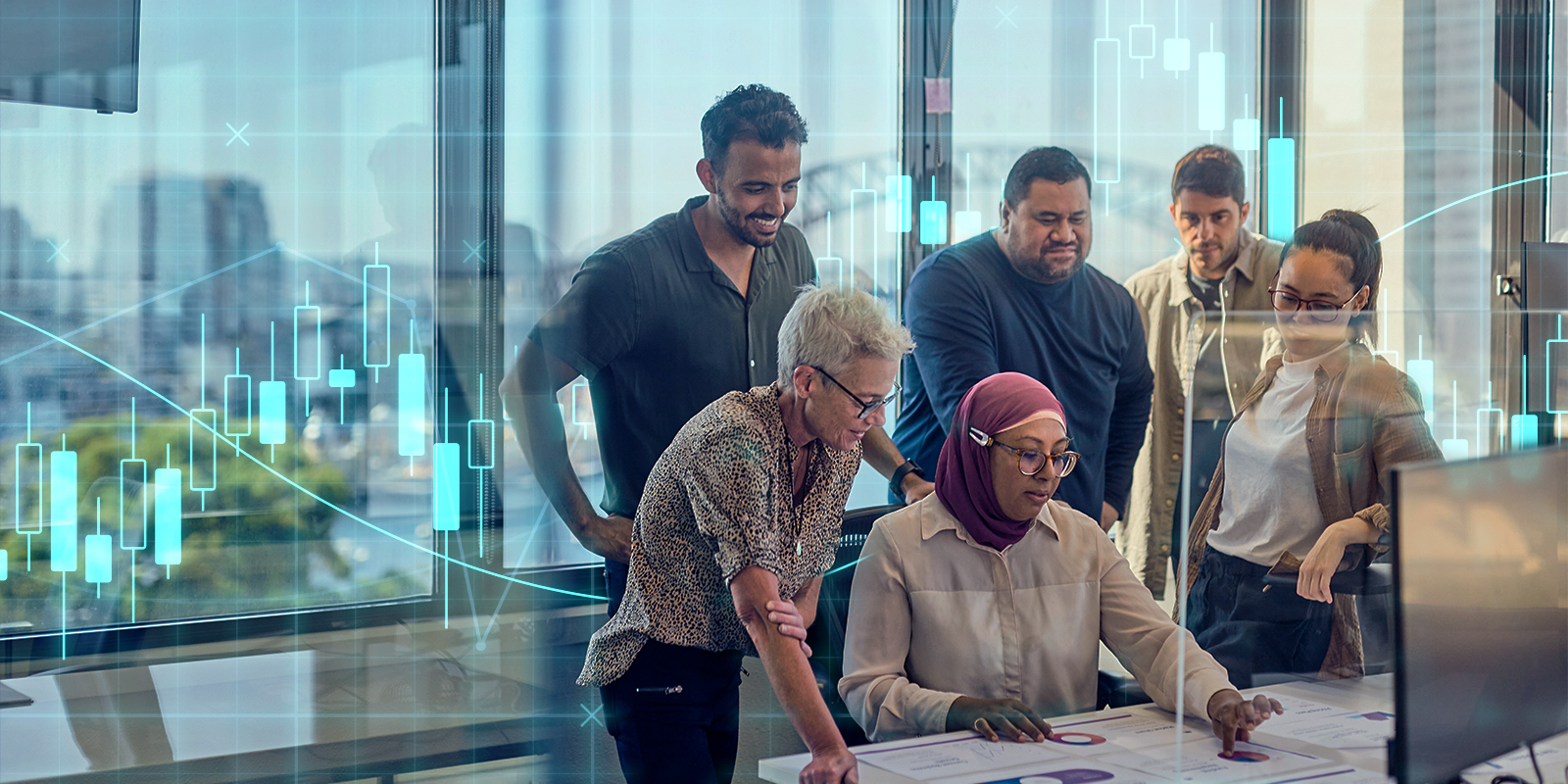 Group of diverse professionals collaborating around a table in a modern office with large windows, overlaid with financial graphs and data, symbolizing teamwork and financial analysis.